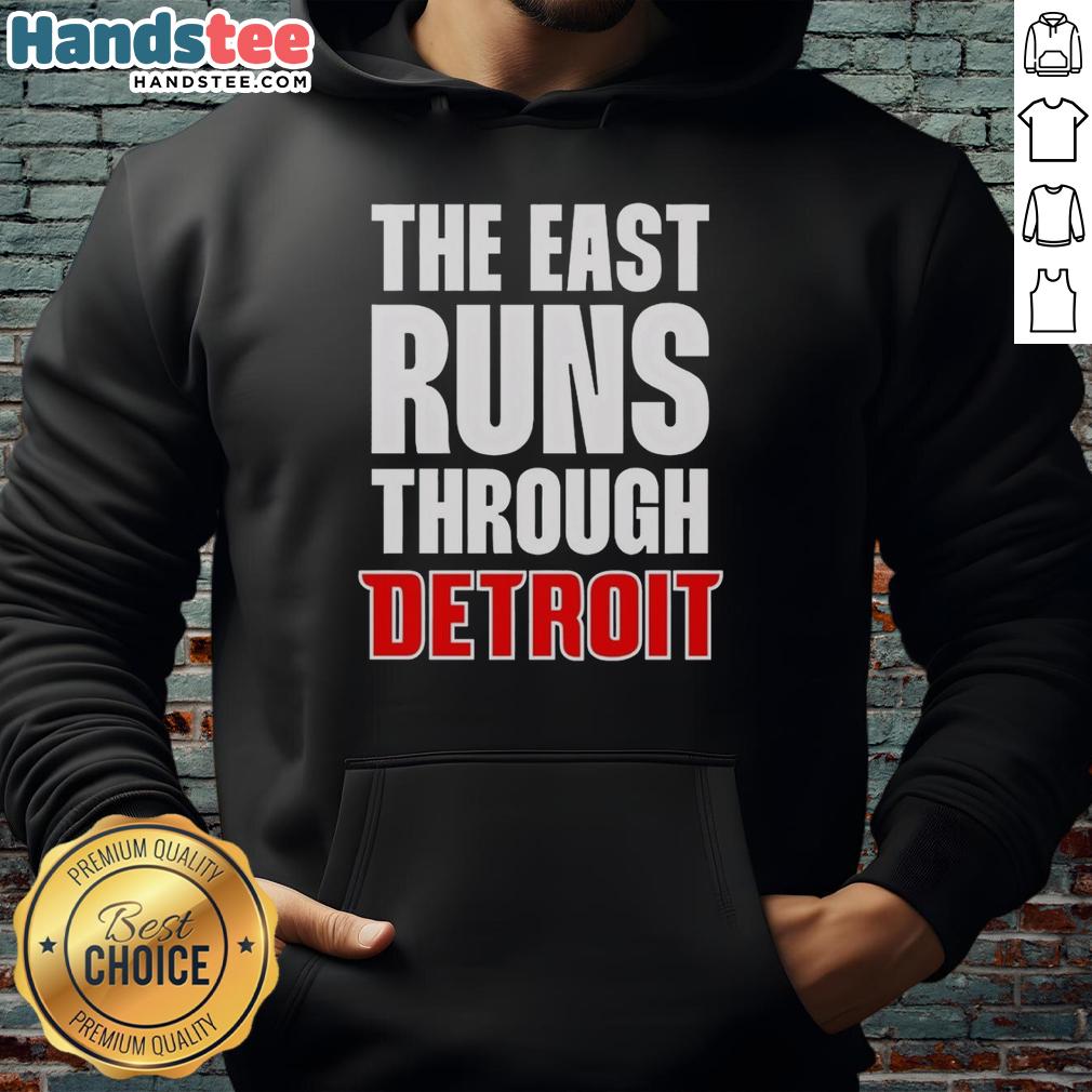 hot-the-east-runs-through-detroit-hoodie Stylish Hot The East Runs Through Detroit hoodie in urban setting, showcasing Detroit pride and streetwear fashion.