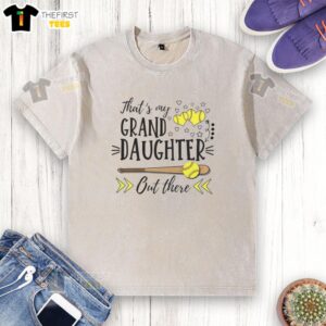 Softball-loving grandma wearing a washed tee with 'That's my granddaughter out there' slogan, showcasing family pride.