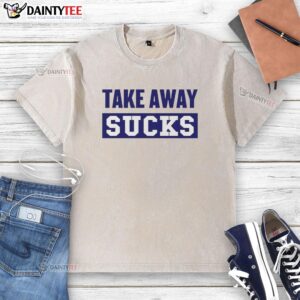 Nice Take Away Sucks washed t-shirt displayed on a hanger, showcasing its casual style and soft fabric.