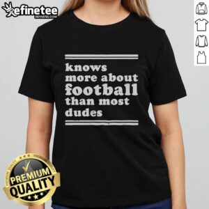 Top Knows More About Football Than Most Dudes Ladies Tee showcasing a stylish design for football-loving women.