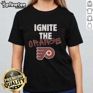 Official Philadelphia Flyers Ignite The Orange 2026 NHL Playoffs Ladies Tee featuring vibrant team colors and logo.