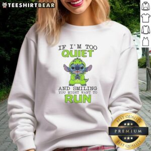 Original Stitch wearing green hoodie with 'If I'm too quiet and smiling, you might want to run' sweatshirt design.