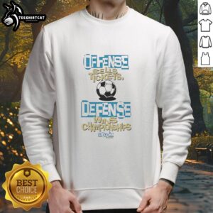Official Defense Wins Championships Offense Sells Tickets Sweatshirt in stylish design, perfect for sports fans and supporters.