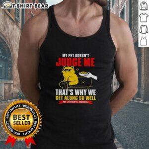 Good orange cat lounging with owner in a stylish tank top; a perfect bond without judgment.