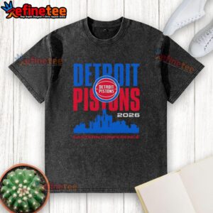 Alt Text: Vintage washed t-shirt featuring the Premium Detroit Pistons logo and Eastern Conference city skyline design.