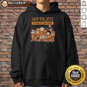 Cozy Good Happiness Is A Spot On The Couch Eternal Dibs Hoodie displayed on a couch, perfect for relaxation and comfort.