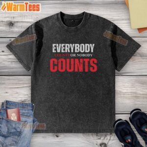 Good Everybody Counts or Nobody Counts washed t-shirt displayed on a hanger, showcasing its unique design and message.