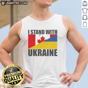Woman wearing a 'Stand With Ukraine' flag tank top, showcasing support for Ukraine in a vibrant outdoor setting.