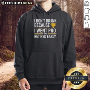 Person wearing a yellow hoodie with 'I Dont Drink, I Went Pro and Retired Early' slogan, showcasing a unique trophy design.