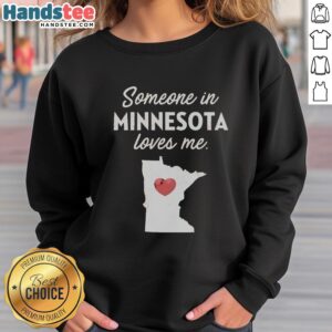 Cozy Premium 'Someone In Minnesota Loves Me' sweatshirt displayed on a rustic wooden background, perfect for warm wear.