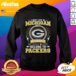Alt Text: Green Bay Packers sweatshirt with text: 'I may live in Michigan, but my heart belongs to Packers' on display.