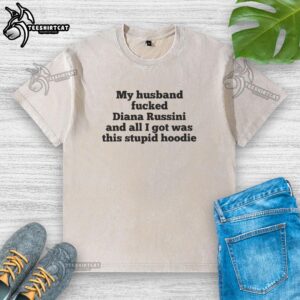 Good My Husband Fucked Dianna Russini washed t-shirt displayed on a hanger, showcasing a unique graphic design.