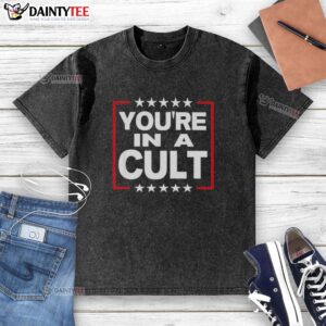 Top You're In A Cult Satirical Political Statement Stars Washed T-Shirt, featuring bold text and a vintage design.