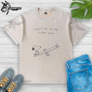 Alt Text: Premium Snoopy playing on a seesaw with Woodstock on a Launch Me To The Moon washed t-shirt design.
