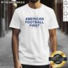 Nice American Football First Ban International Games T-Shirt featuring a vibrant design, perfect for fans and collectors.