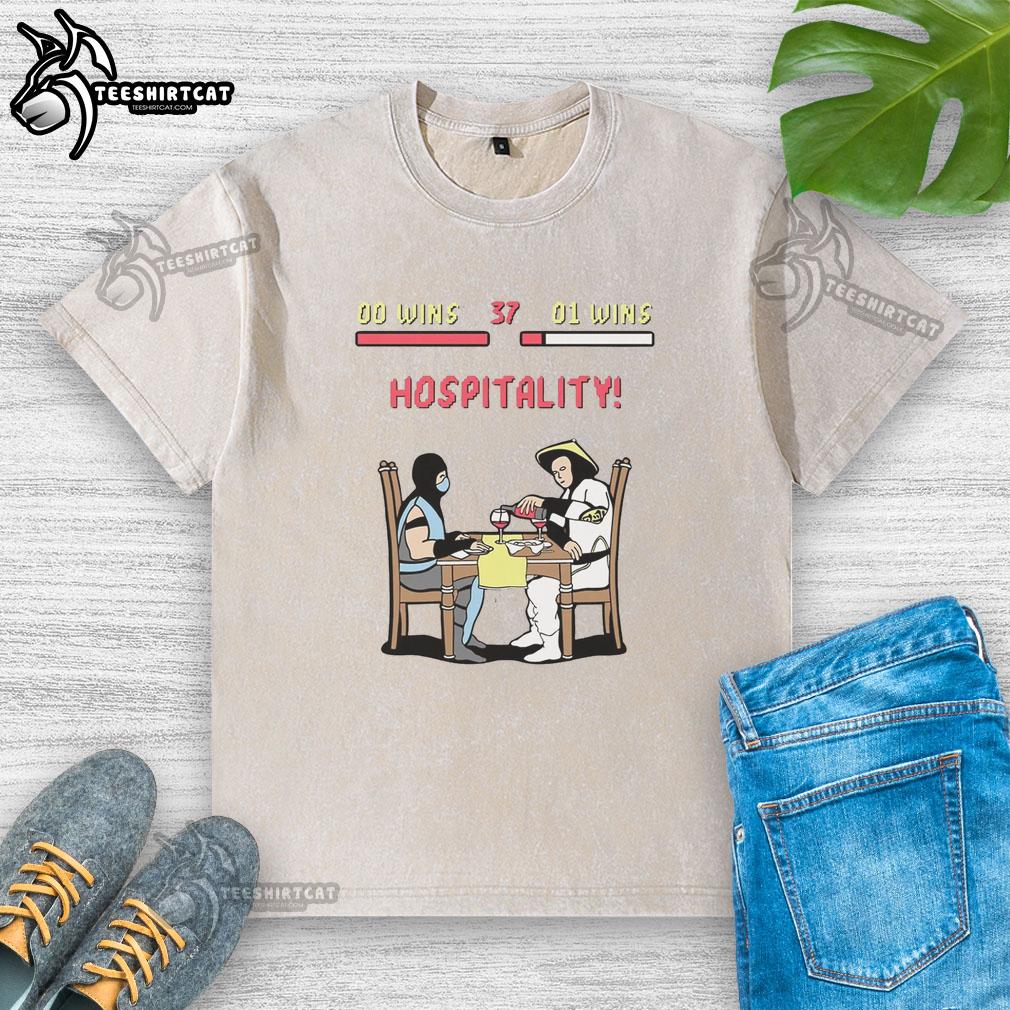 nice-fighting-game-rivals-at-dinner-washed-t-shirt Two friends wearing Nice Fighting Game Rivals t-shirts enjoy dinner together, showcasing their gaming passion.