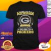 Green Bay Packers NFL t-shirt with 'I may live in Michigan, but my heart belongs to Packers' slogan.