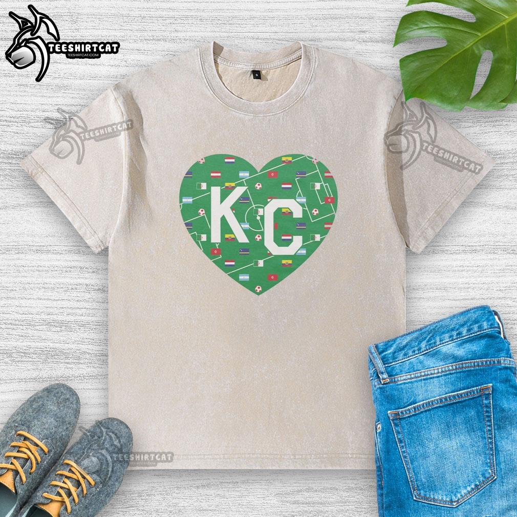 nice-soccer-field-kc-heart-vintage-washed-t-shirt Alt Text: Vintage washed t-shirt featuring a nice soccer field design, perfect for soccer enthusiasts and casual wear.