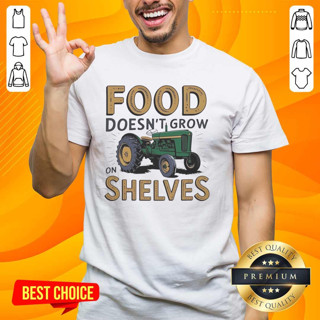 nice-tractor-food-doesnt-grow-on-shelves-vintage-t-shirt Vintage T-Shirt featuring a nice tractor and the phrase 'Food Doesnt Grow On Shelves' for farm and gardening enthusiasts.