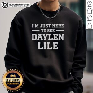Person wearing 'Just Here to See Daylen Lile' sweatshirt, showcasing a trendy and comfortable fashion statement.