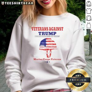 Alt Text: Top Veterans Against Draft Dodger In Chief sweatshirt worn by a Marine Corps veteran, showcasing military pride.
