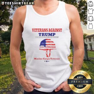 Marine Corps veteran wearing tank top at rally, highlighting top veterans against draft dodger in chief.