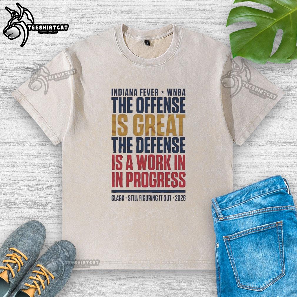 official-caitlin-clark-defense-wnba-still-figuring-it-out-fever-2026-washed-t-shirt Caitlin Clark in a WNBA game, wearing the 'Still Figuring It Out' 2026 washed t-shirt, showcasing her defensive skills.