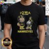 Official Charlie Brown and Snoopy X Iowa Hawkeyes NCAA Football T-Shirt, established 1891, featuring playful graphics.