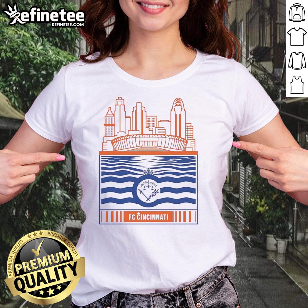 official-fc-cincinnati-city-skyline-stadium-with-river-and-logo-retro-ladies-tee Alt Text: Retro ladies tee featuring the official FC Cincinnati logo with the city skyline and river stadium backdrop.