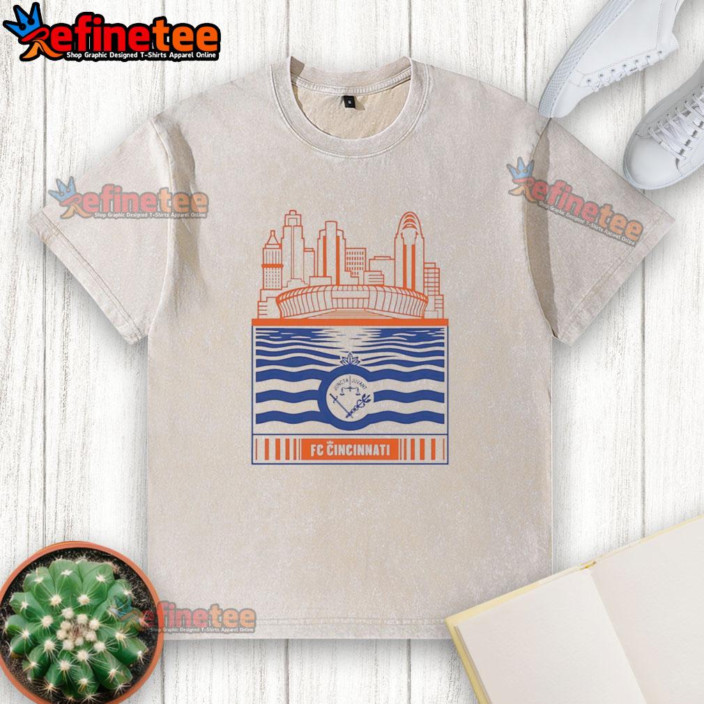 official-fc-cincinnati-city-skyline-stadium-with-river-and-logo-retro-washed-t-shirt Official FC Cincinnati city skyline stadium t-shirt featuring retro washed design with logo and river backdrop.