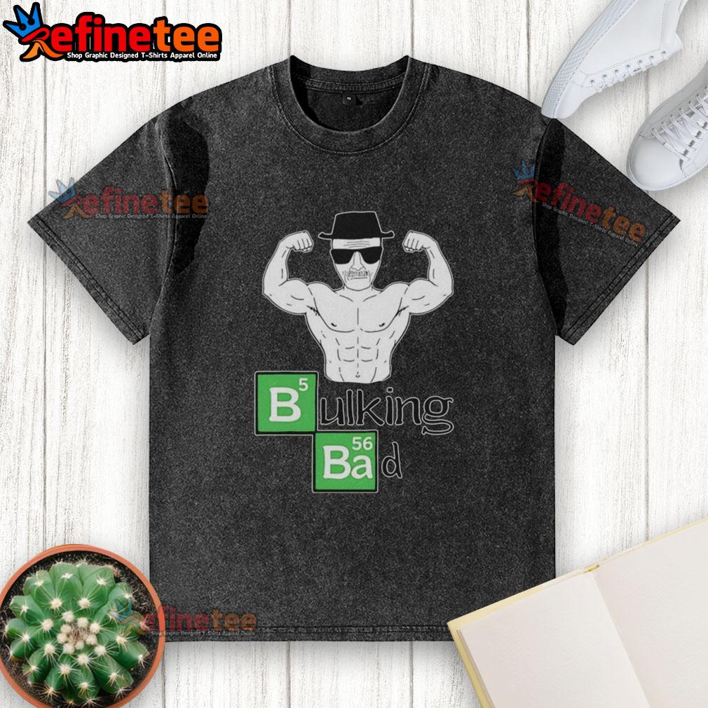 official-old-man-muscular-posing-bicep-bulking-bad-washed-t-shirt Muscular old man posing with biceps in a bulking bad washed t-shirt, showcasing strength and fitness.