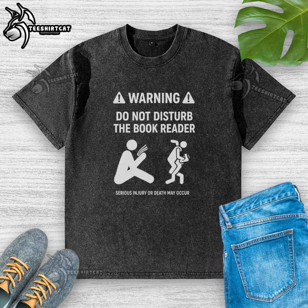 official-warning-do-not-disturb-the-book-reader-serious-injury-or-death-may-occur-washed-t-shirt Alt Text: Official warning t-shirt: 'Do Not Disturb the Book Reader' - serious injury or death may occur, perfect for book lovers.