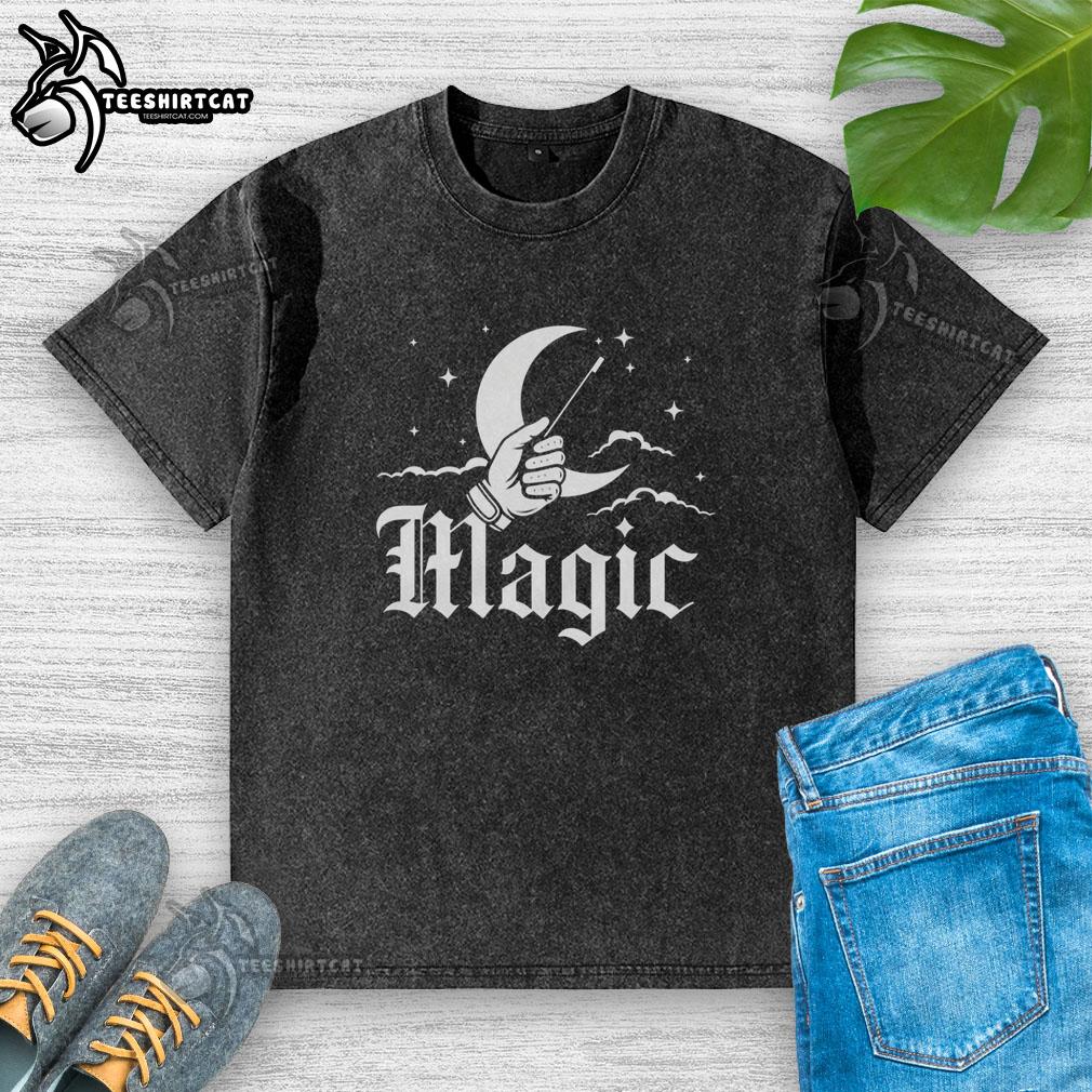 original-magic-hand-holding-a-magic-wand-in-front-of-a-crescent-moon-vintage-washed-t-shirt Alt Text: Vintage washed t-shirt featuring a magic hand holding a wand in front of a crescent moon design.