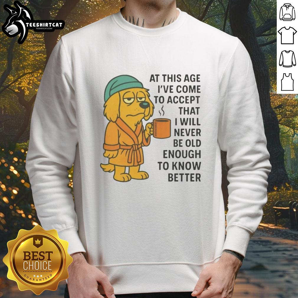 original-sleepy-dog-in-robe-coffee-mug-never-old-enough-to-know-better-sweatshirt Sleepy dog in a robe with a coffee mug, wearing 'Never Old Enough To Know Better' sweatshirt, cozy and cute.