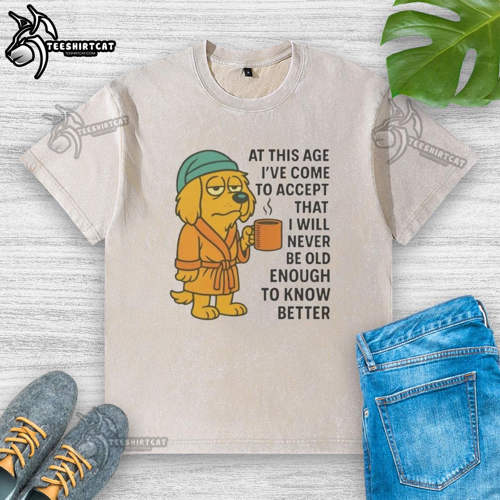 original-sleepy-dog-in-robe-coffee-mug-never-old-enough-to-know-better-washed-t-shirt Sleepy dog in a robe with a coffee mug, featuring a 'Never Old Enough to Know Better' washed t-shirt design.