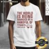 Alt Text: Original 'The World Is Being Ruled By A Ravaged Handful Of Tyrants' Pope Leo XIV T-Shirt design featuring bold typography.