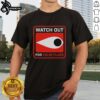 Alt Text: Original Watch Out For False Flags Eye Clay Graham T-Shirt featuring bold graphic design and vibrant colors.
