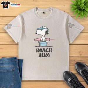 Alt Text: Pretty Peanuts Beach Bum Snoopy washed t-shirt featuring a playful Snoopy design perfect for summer outings.