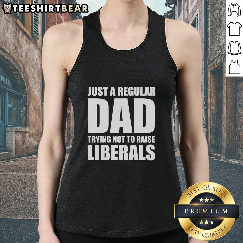 premium-just-a-regular-dad-trying-not-to-raise-liberals-humor-tank-top Premium Just A Regular Dad Trying Not To Raise Liberals Humor Tank Top showcasing a humorous graphic design for dads.