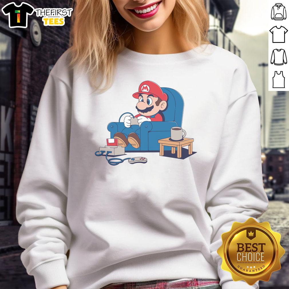 pretty-gamer-boy-mario-sweatshirt Stylish gamer boy wearing a Mario sweatshirt, showcasing vibrant colors and a trendy gaming aesthetic.