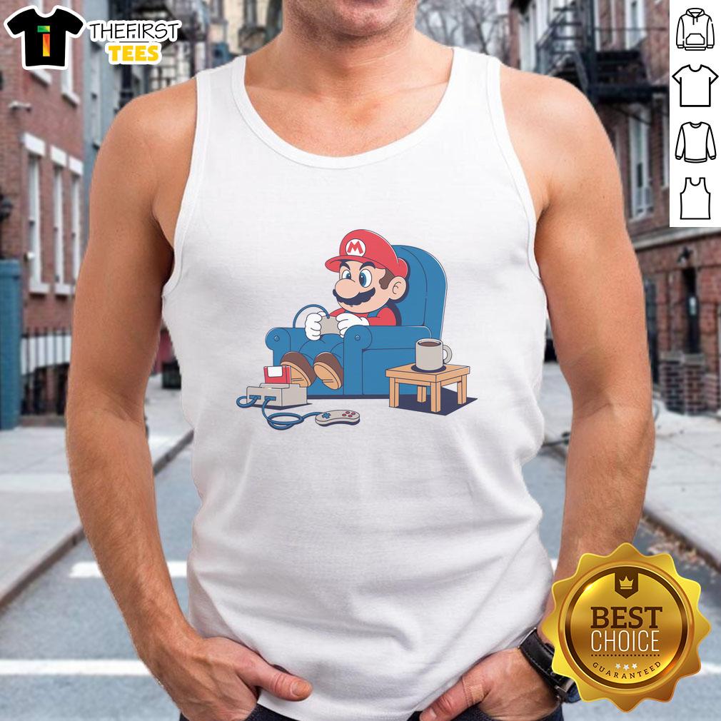 pretty-gamer-boy-mario-tank-top Pretty gamer boy wearing a Mario tank top, showcasing a colorful design and a playful gaming vibe.