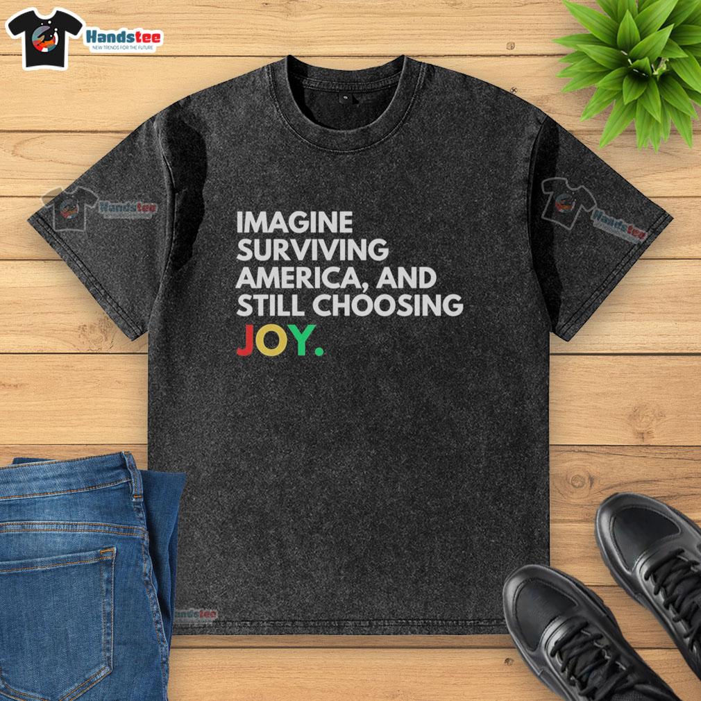 pretty-imagine-surviving-america-and-still-choosing-joy-washed-t-shirt Alt Text: Pretty Imagine Surviving America and Still Choosing Joy washed t-shirt in soft cotton, featuring a vibrant graphic design.