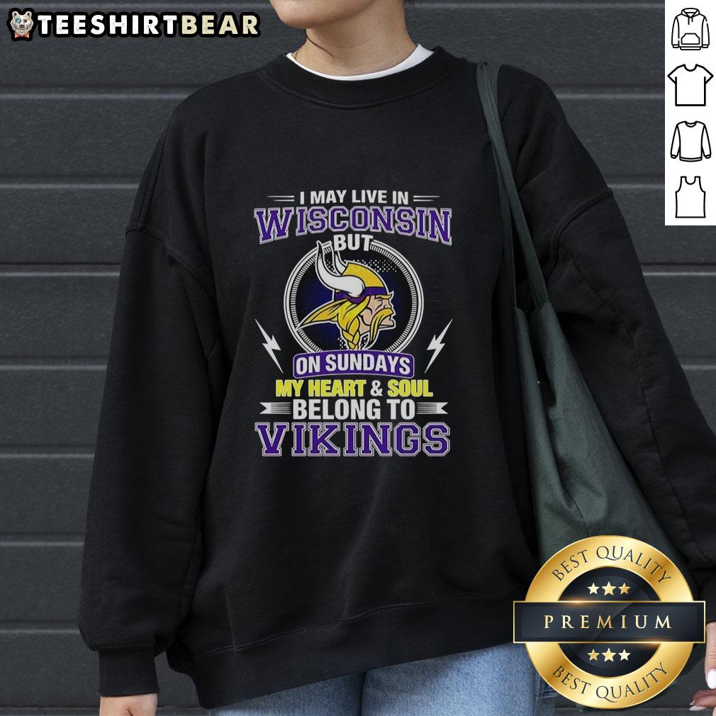 pretty-minnesota-vikings-nfl-i-may-live-in-wisconsin-on-sundays-my-heart-and-soul-belong-to-vikings-sweatshirt Cozy Minnesota Vikings sweatshirt with text 'I may live in Wisconsin, but my heart belongs to Vikings' in purple and gold.