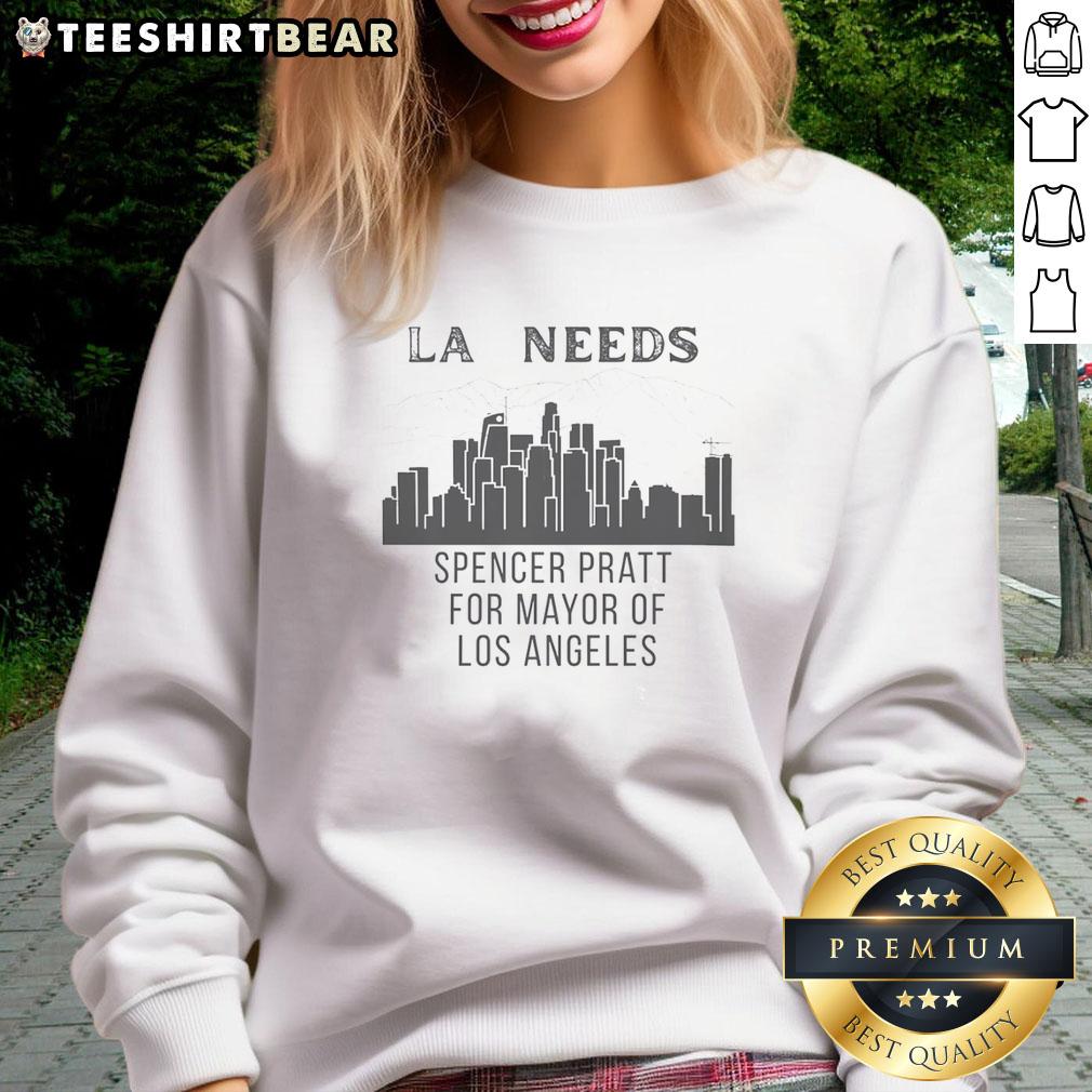 pretty-spencer-pratt-los-angeles-la-needs-cityscape-for-mayor-of-sweatshirt Spencer Pratt wearing a 'Los Angeles Needs Cityscape' sweatshirt against a vibrant LA cityscape background.