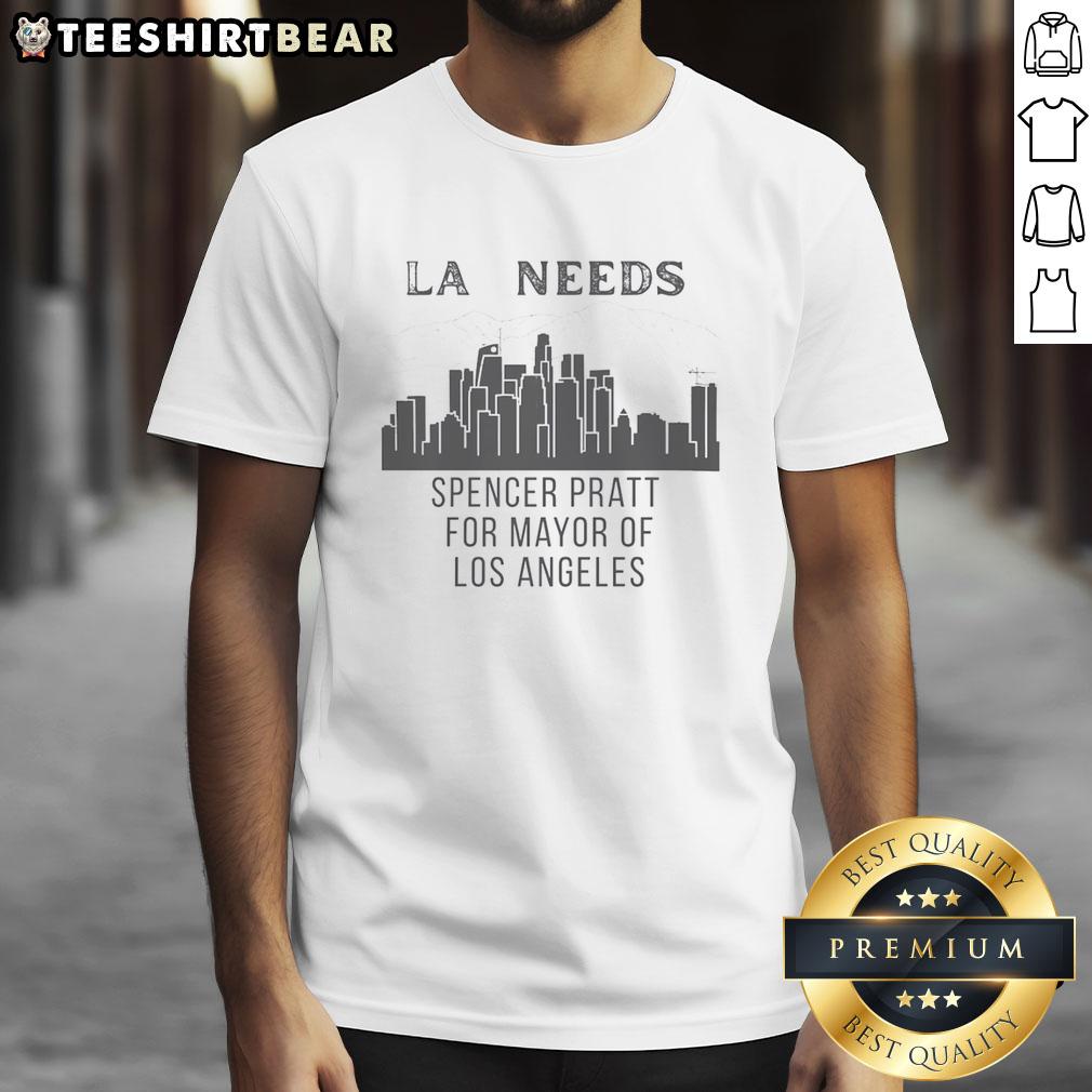 pretty-spencer-pratt-los-angeles-la-needs-cityscape-for-mayor-of-t-shirt Pretty Spencer Pratt wearing 'Los Angeles Needs Cityscape For Mayor' T-shirt against a vibrant LA skyline backdrop.