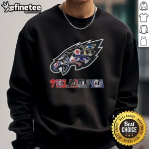 Alt Text: Philadelphia Eagles NFL sweatshirt featuring a collage of Philadelphia sports team logos in vibrant colors.