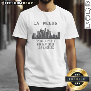 Pretty Spencer Pratt wearing 'Los Angeles Needs Cityscape For Mayor' T-shirt against a vibrant LA skyline backdrop.