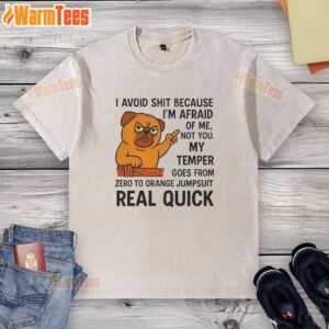 Pretty angry pug in an orange jumpsuit, showcasing its temper while wearing a washed t-shirt.