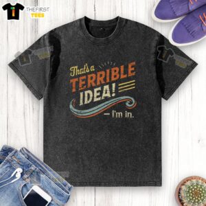 Person wearing a washed t-shirt with the phrase 'Hot Terrible Idea' printed, showcasing casual fashion and humor.