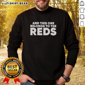 Good Ashley Davis wearing 'This One Belongs to the Reds' sweatshirt in a casual setting, showcasing stylish fan apparel.